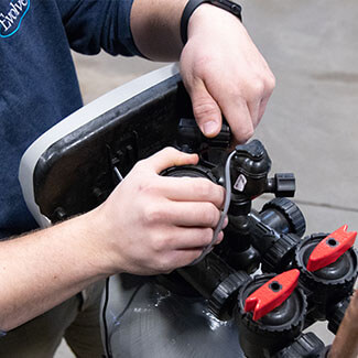 Technician working on a water filtration system