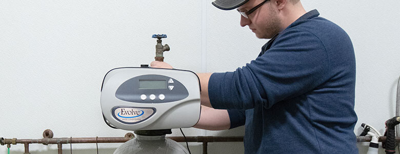 Technician working on a Water Filtration System